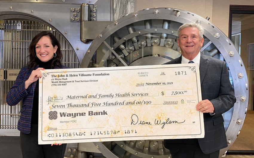 Wayne County's Maternail and Family Health Services received a Villaume Foundation grant. Maria Montoro Edwards, left, from Maternal and Family Health Services and Paul Edwards, Villaume Foundation board member.